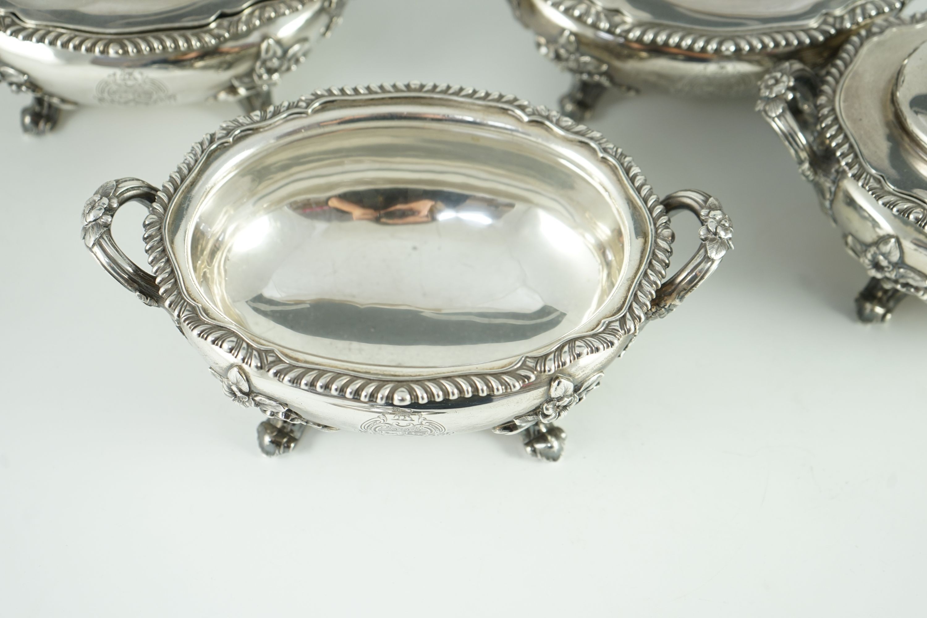 Benacre Hall, Suffolk. A good set of four Victorian silver two handled oval sauce tureens and covers, by Edward & John Barnard